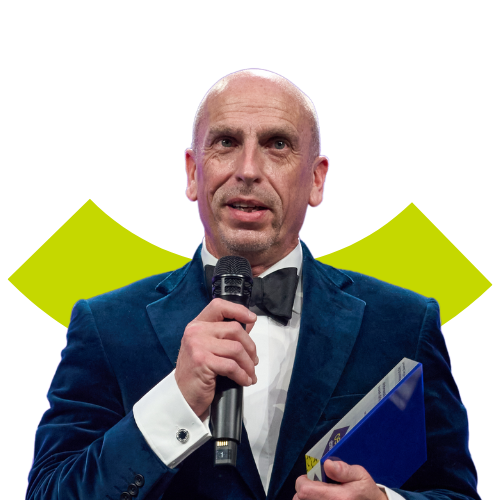 Portrait of a bald middled aged white man holding a microphone